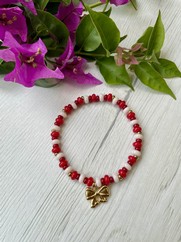 BRACCIALE ELASTICO ROSSO E CHARM FIOCCO