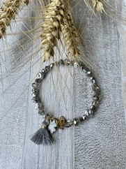 BRACCIALE RIGIDO CON CRISTALLI GRIGIO E NAPPINA