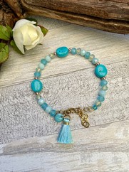 BRACCIALE RIGIDO CON CRISTALLI TURCHESE E NAPPINA